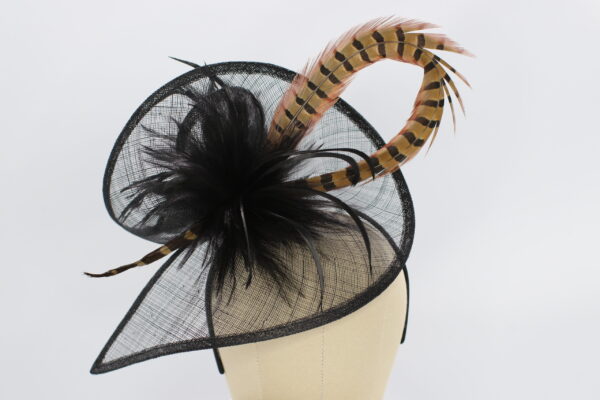 Navy blue fascinator Hat with a pheasant feather swirl
